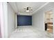 Spacious primary bedroom with tray ceiling, neutral carpet, and ensuite bathroom access at 150 Churchill Rd, Louisburg, NC 27549