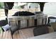 The outdoor kitchen has a stainless steel grill and drawers, creating a convenient and stylish cooking area at 150 Churchill Rd, Louisburg, NC 27549