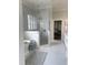 Elegant bathroom with a frameless shower, soaker tub, and marble tile at 1512 Obrien Cir, Wake Forest, NC 27587