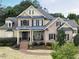 Charming brick home with a covered front porch and beautifully landscaped front yard at 1512 Obrien Cir, Wake Forest, NC 27587