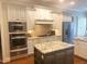 Modern kitchen featuring stainless steel appliances, granite countertops, and an island at 1512 Obrien Cir, Wake Forest, NC 27587