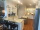 Bright kitchen featuring white cabinetry, granite countertops, stainless steel appliances, and double islands at 1512 Obrien Cir, Wake Forest, NC 27587