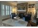Cozy living room with a stone fireplace, built-in shelving, and comfortable seating at 1512 Obrien Cir, Wake Forest, NC 27587
