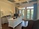 Well-lit office with a coffered ceiling, large windows, hardwood floors, and ample workspace at 1512 Obrien Cir, Wake Forest, NC 27587