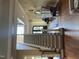 Elegant staircase with hardwood steps, a patterned runner, and black iron railing leading to the upper level at 1512 Obrien Cir, Wake Forest, NC 27587
