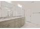 Bathroom featuring dual sink vanity with granite counters, white cabinets, and tiled floors at 156 Harmony Trl, Broadway, NC 27505