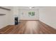 Bright living room with hardwood floors, a fireplace, white trim and a large window at 156 Harmony Trl, Broadway, NC 27505