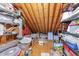 Unfinished attic space with plywood flooring and ceiling storage at 1901 White Oak Rd, Raleigh, NC 27608