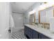 Elegant bathroom with dual sinks, marble countertops, and a subway tile shower at 1901 White Oak Rd, Raleigh, NC 27608