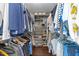Walk-in closet featuring wood floors and ample storage and shelving at 1901 White Oak Rd, Raleigh, NC 27608