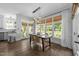 Cozy dining area with backyard views and a modern light fixture at 1901 White Oak Rd, Raleigh, NC 27608