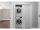Convenient laundry room with a stacked washer and dryer unit tucked behind doors at 1901 White Oak Rd, Raleigh, NC 27608