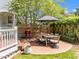 Backyard patio with a dining set, grill, and garden, perfect for outdoor dining and relaxation at 1901 White Oak Rd, Raleigh, NC 27608