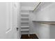 Organized walk-in closet featuring custom shelving and ample hanging space at 1901 White Oak Rd, Raleigh, NC 27608