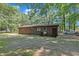 Back of a brick house with a large backyard at 2005 Messer Rd, Raleigh, NC 27603