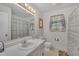 Bathroom with large mirror over sink at 2005 Messer Rd, Raleigh, NC 27603