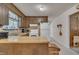Traditional kitchen features wood cabinets and includes white appliances at 2005 Messer Rd, Raleigh, NC 27603