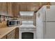 White kitchen appliances including microwave and range at 2005 Messer Rd, Raleigh, NC 27603