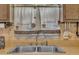 Close up of kitchen sink, cabinets, and the window over the sink at 2005 Messer Rd, Raleigh, NC 27603