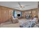 Relaxing living room with wood-paneled walls, brick fireplace, and comfortable furnishings at 2005 Messer Rd, Raleigh, NC 27603