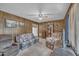 Comfortable living room features paneled walls, a ceiling fan, and a cozy, inviting atmosphere at 2005 Messer Rd, Raleigh, NC 27603