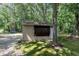 Exterior view of the shed in backyard featuring a light-colored exterior, perfect for storage and hobbies at 2005 Messer Rd, Raleigh, NC 27603