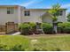 Exterior view of the townhome backyard showing the patio, fence, shrubs and air conditioner at 2021 Rivergate Rd # 102, Raleigh, NC 27614