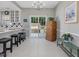 Bright dining area featuring a breakfast bar, with sliding doors to a patio at 2021 Rivergate Rd # 102, Raleigh, NC 27614