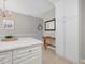 Additional view of the kitchen with chandelier and lots of white cabinetry and drawers at 2021 Rivergate Rd # 102, Raleigh, NC 27614