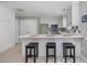 Bright kitchen boasts breakfast bar with seating, ample cabinet space, and modern appliances at 2021 Rivergate Rd # 102, Raleigh, NC 27614