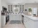Beautiful kitchen features stainless steel appliances, white cabinets, and stylish tile backsplash at 2021 Rivergate Rd # 102, Raleigh, NC 27614