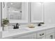 Bathroom features a double vanity with a white countertop and dark hardware at 205 Shawnee Dr, Louisburg, NC 27549