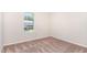 Empty carpeted bedroom with one window at 2108 Carthage Cir, Raleigh, NC 27604
