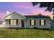 Charming single-story home with a front porch, green lawn, and freshly painted exterior at 2108 Carthage Cir, Raleigh, NC 27604