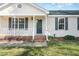 Close-up of a well-kept front porch with decorative landscaping at 2108 Carthage Cir, Raleigh, NC 27604