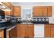 Kitchen featuring stainless steel appliances and black and white backsplash at 2108 Carthage Cir, Raleigh, NC 27604
