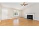 Spacious living room with a fireplace, ceiling fan, and natural light at 2108 Carthage Cir, Raleigh, NC 27604