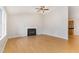 Bright living room featuring a fireplace and light wood floors at 2108 Carthage Cir, Raleigh, NC 27604