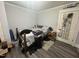 Bedroom with hardwood floors, queen bed, and closet at 212 S Sixth St, Smithfield, NC 27577