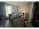 Cozy bedroom with wood-look flooring, natural light, and closet space at 212 S Sixth St, Smithfield, NC 27577