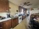 Functional kitchen features modern appliances, laminate countertops, and tile flooring at 212 S Sixth St, Smithfield, NC 27577
