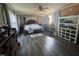 Spacious bedroom featuring wood flooring and windows offering natural light and providing a calm living space at 212 S Sixth St, Smithfield, NC 27577
