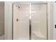 Bathroom featuring a shower with glass doors and a built-in seat at 213 Clement Ave, Oxford, NC 27565