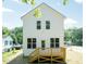 Charming two-story home with a newly constructed porch and stairs, nestled in a quiet neighborhood at 213 Clement Ave, Oxford, NC 27565