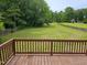 View of a large backyard from wooden deck at 216 Edgecombe Dr, Spring Lake, NC 28390