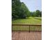 View of a large backyard from wooden deck at 216 Edgecombe Dr, Spring Lake, NC 28390