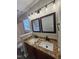 Modern bathroom featuring a double vanity with granite countertops at 216 Edgecombe Dr, Spring Lake, NC 28390