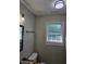 Bathroom featuring granite counters, black fixtures, and natural light at 216 Edgecombe Dr, Spring Lake, NC 28390