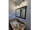 Bathroom featuring granite counters, black fixtures, and vanity at 216 Edgecombe Dr, Spring Lake, NC 28390