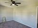 Carpeted bedroom featuring neutral walls and natural lighting from the window at 216 Edgecombe Dr, Spring Lake, NC 28390